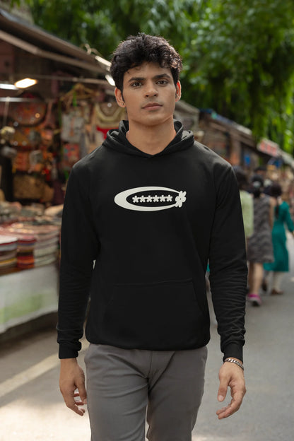 First front view of a male model model wearing a black hoodie with a design featuring berry bushes overflowing with fruit, symbolizing the abundance and beauty of nature.