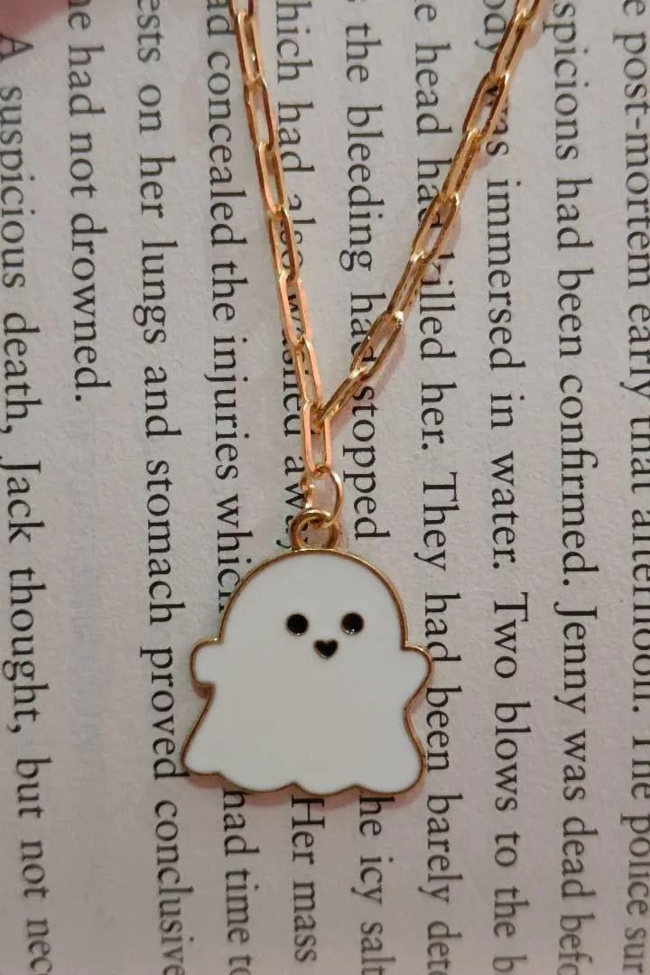 Third view of an anti tarnish gold chain necklace featuring a cute white ghost design.