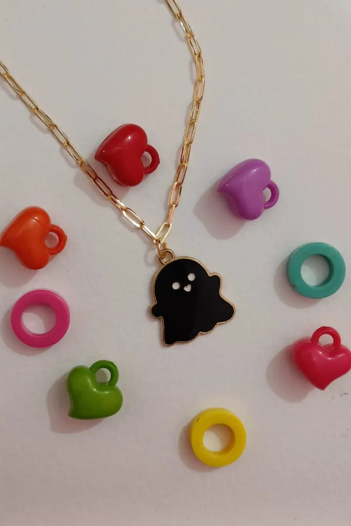 First view of an anti tarnish gold chain necklace featuring a cute black ghost design.