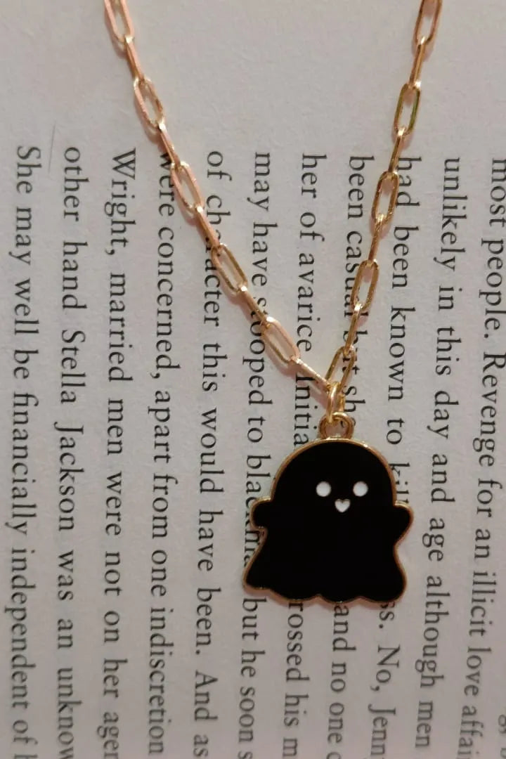 Second view of an anti tarnish gold chain necklace featuring a black cute ghost design.