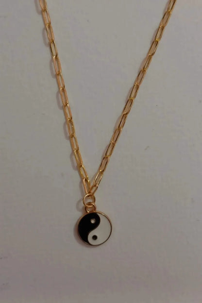 Fourth image of a yin and yang gold chain.