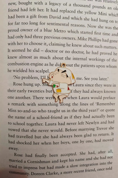 Fourth view of a charm featuring a mischievous Shinchan design.