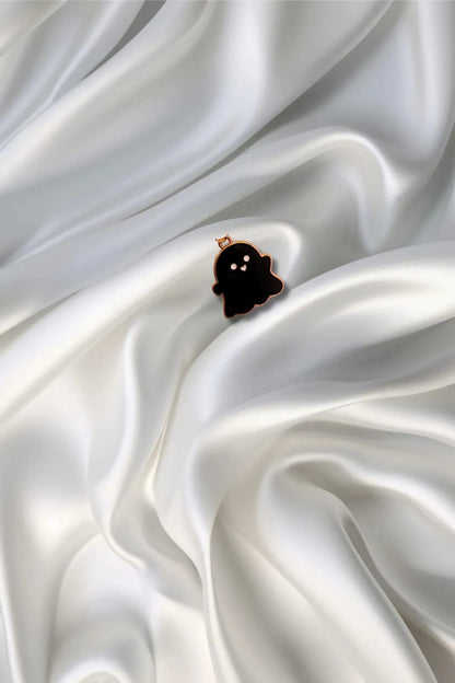 Third view of a charm featuring a cute black spooky adorable ghost design.