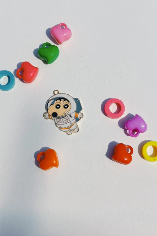 Fourth view of a cute charm featuring Shinchan in a space suit, exploring the cosmos.