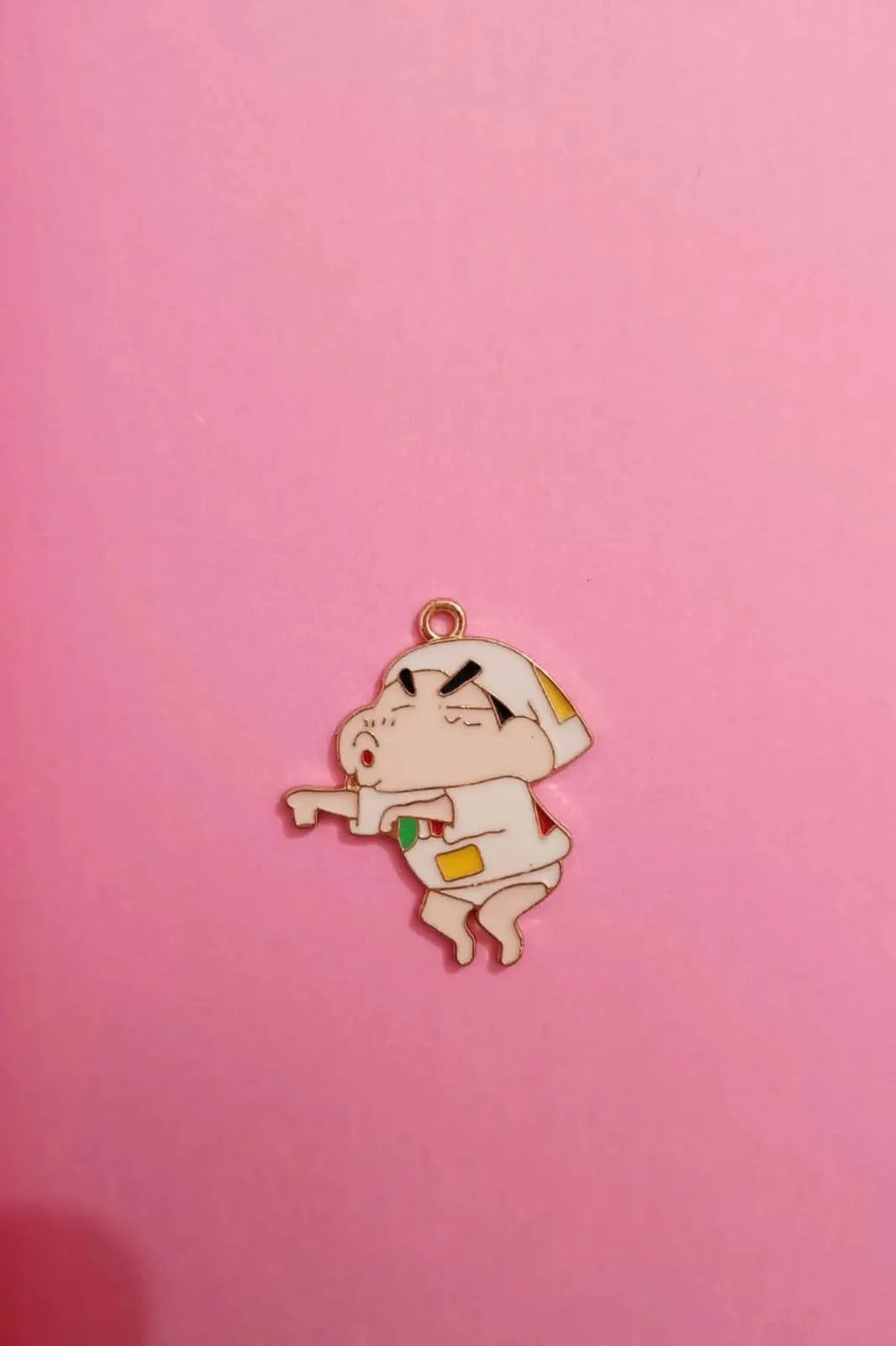 Third view of a charm featuring a mischievous Shinchan design.