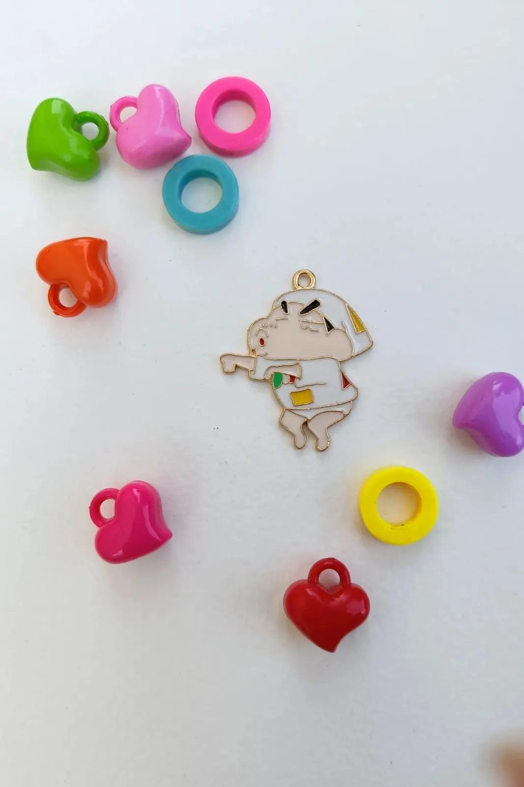 Second view of a charm featuring a mischievous Shinchan design.
