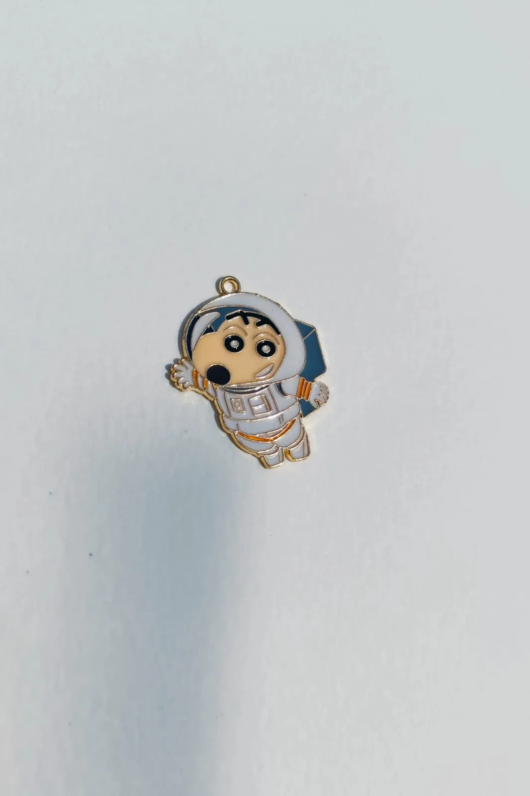 Third view of a cute charm featuring Shinchan in a space suit, exploring the cosmos.