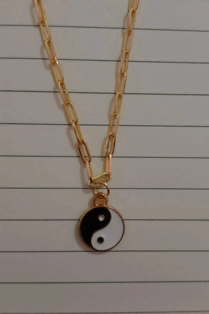 Third image of a yin and yang gold chain.