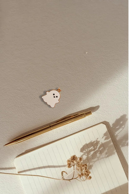 Third view of a charm featuring a cute white spooky adorable ghost design.