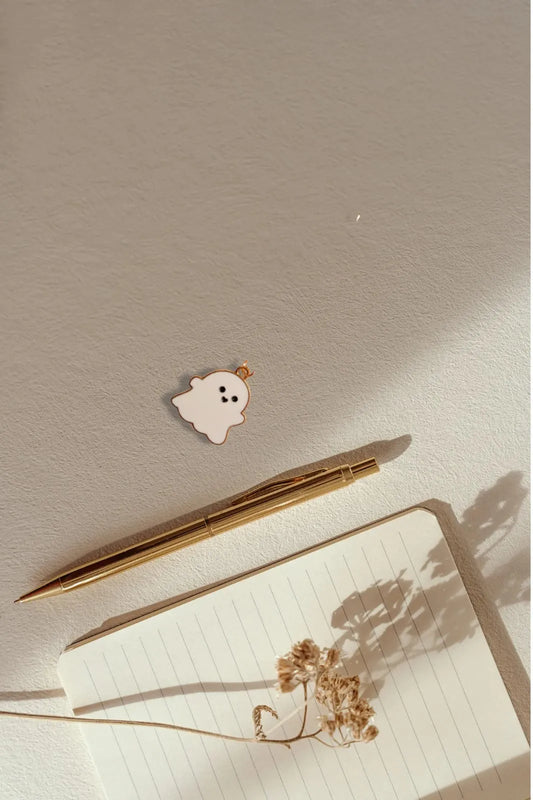 Third view of a charm featuring a cute white spooky adorable ghost design.