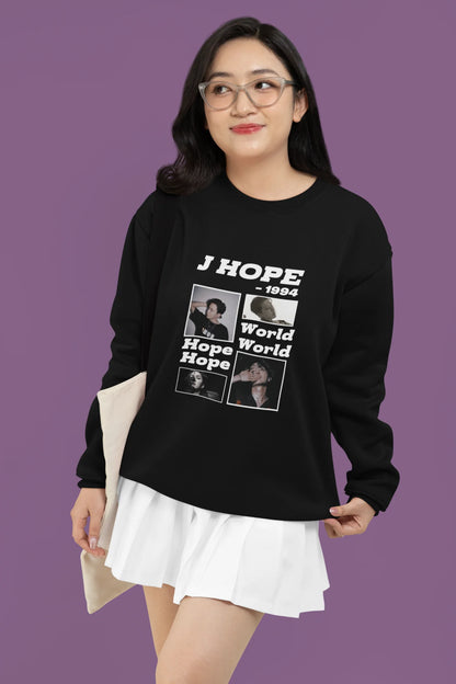 Third front view of a female model wearing a black sweatshirt featuring a vibrant design inspired by BTS member J-Hope (Hoseok). Ideal for BTS fans (ARMY) and K-Pop enthusiasts who love dance and rap-focused music.