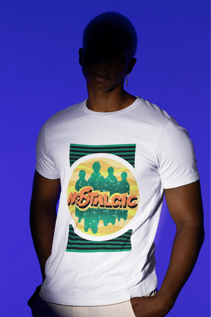Second view of a male model wearing an oversized off-white t-shirt with a shadow silhouette of the Coldplay band members and the word "Nostalgic" printed on it.