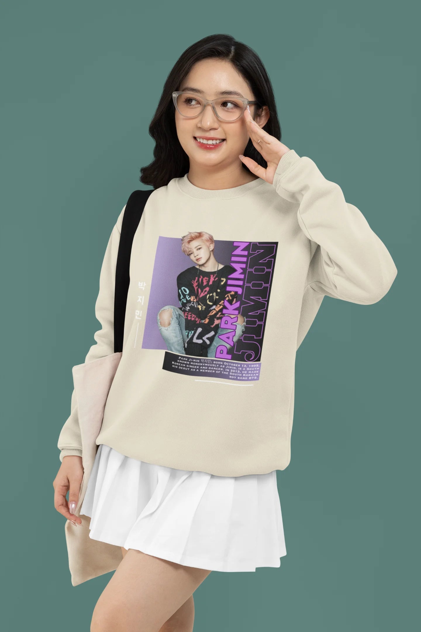 Fourth front view of female model wearing a cream sweat shirt featuring a bold design inspired by BTS member Park Jimin (Jimin). Ideal for BTS fans (ARMY) and K-Pop enthusiasts who love dance-focused music.