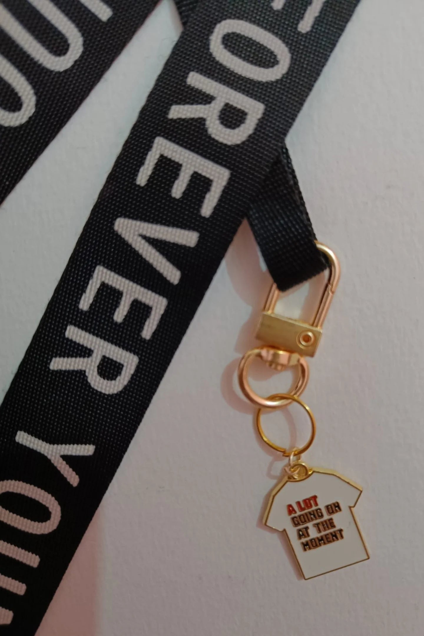 Third view of a keychain featuring a design inspired by Taylor Swift's "Midnights" album. Perfect for Swifties.