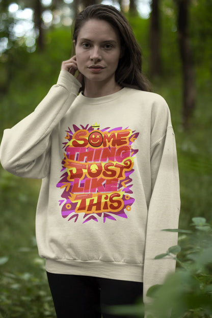 First front view of a female model wearing an cream sweatshirt featuring the designs inspired from Coldplay's "Something Just Like This" music video.