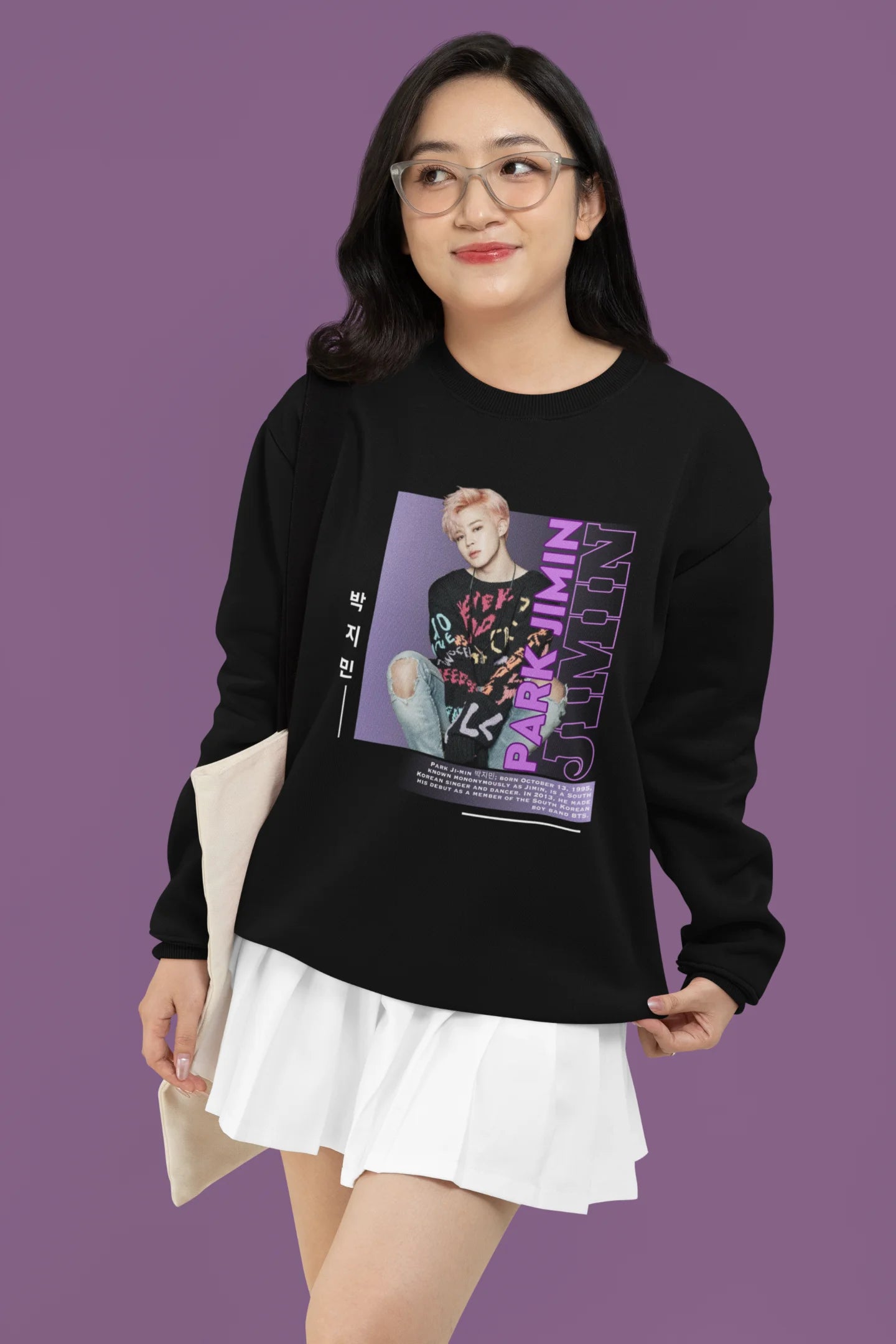 Third front view of female model wearing a black sweat shirt featuring a bold design inspired by BTS member Park Jimin (Jimin). Ideal for BTS fans (ARMY) and K-Pop enthusiasts who love dance-focused music.