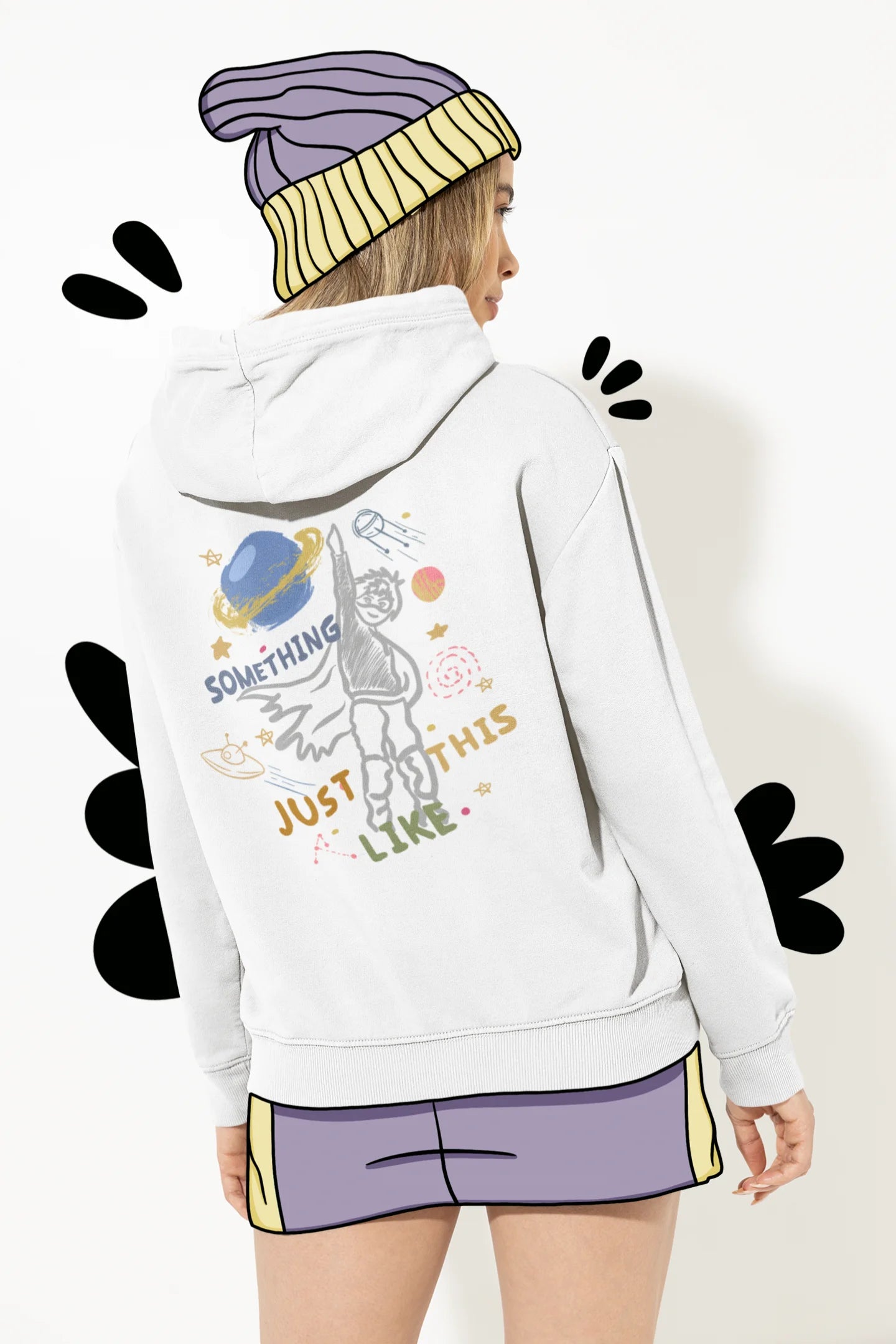 Back view of a female model wearing an off-white hoodie with a design inspired by the "Something Just Like This" music video, featuring the word "Superheroes".