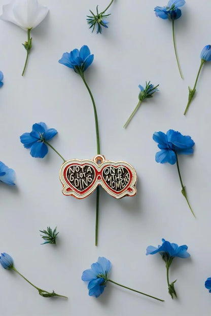 Third view of a charm featuring a design inspired by Taylor Swift's "Evermore" album.