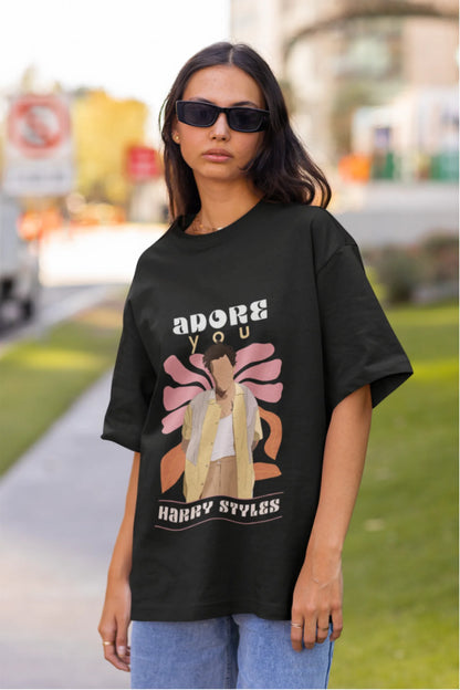 Second image of woman wearing black oversized t-shirt featuring 'Adore You' inspired design - ideal for fans of Harry Styles and One Direction