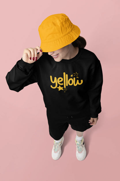 Third front view of a female model wearing a black sweatshirt with the "Yellow" album artwork by Coldplay.