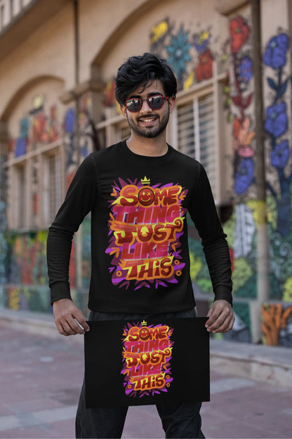 First front view of a male model wearing an black sweatshirt featuring the designs inspired from Coldplay's "Something Just Like This" music video.