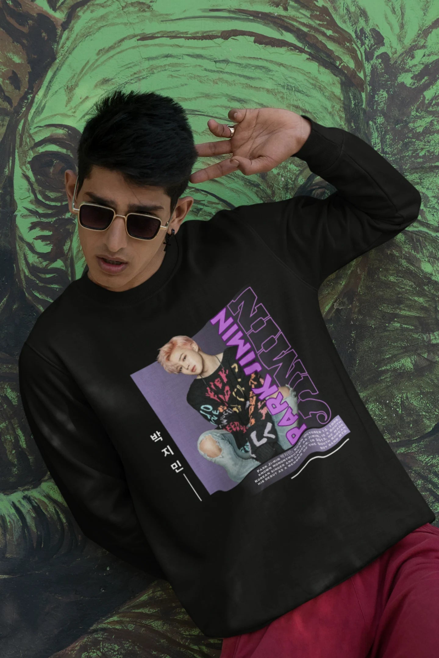 Third front view of male model wearing a black sweat shirt featuring a bold design inspired by BTS member Park Jimin (Jimin). Ideal for BTS fans (ARMY) and K-Pop enthusiasts who love dance-focused music.