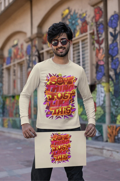 Second front view of a male model wearing an cream sweatshirt featuring the designs inspired from Coldplay's "Something Just Like This" music video.