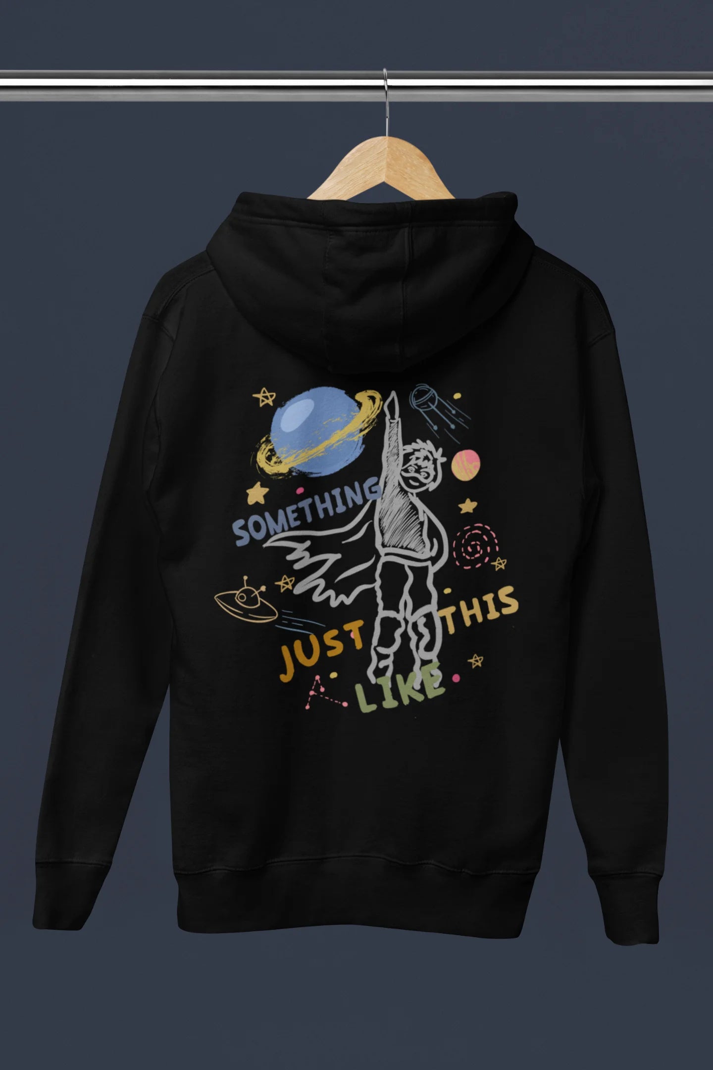Back view an black hoodie with a design inspired by the "Something Just Like This" music video, featuring the word "Superheroes".