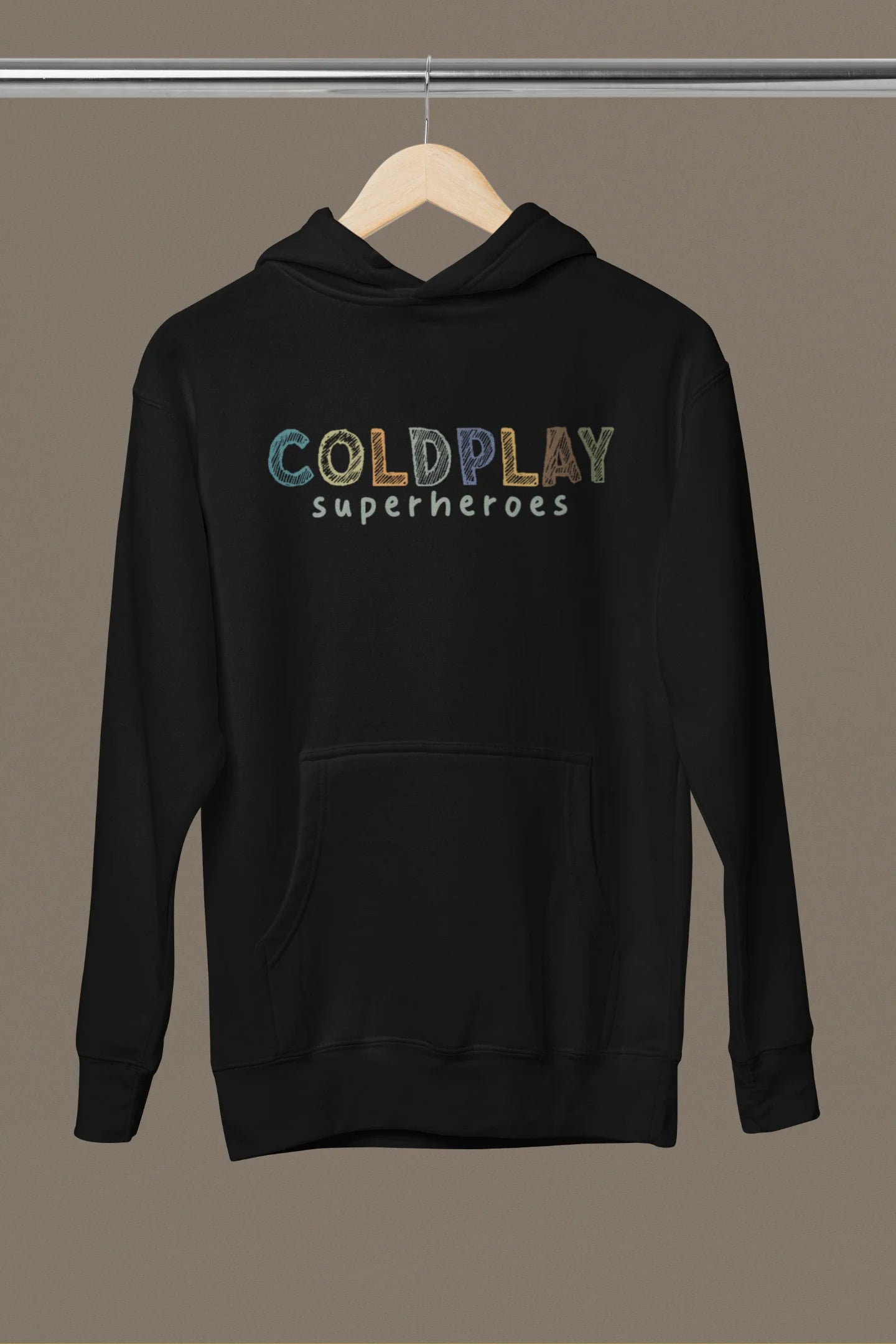 Front view of an black hoodie with a design inspired by the "Something Just Like This" music video, featuring the word "Superheroes".