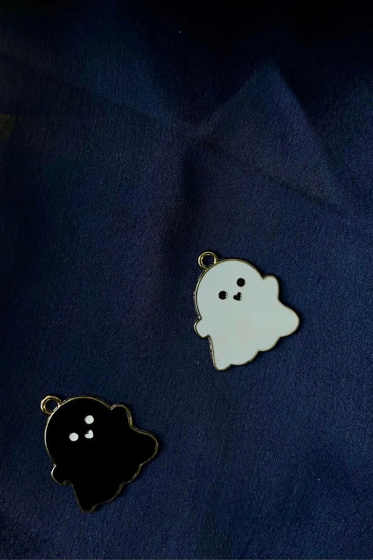 First view of black and white charms featuring a cute spooky adorable ghost design.