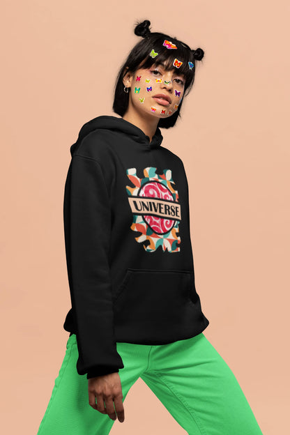 First front view of a female model wearing an black hoodie with a cosmic Universe design inspired by Coldplay.