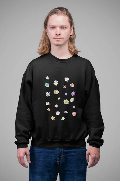 4th front view of a male model wearing to a black sweatshirt featuring a vibrant floral design with roses, tulips, sunflowers, and orchids. Ideal for those who love floral patterns and spring fashion.