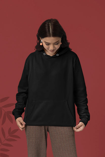 First front view of a female model wearing a black hoodie with a heron taking off under the moonlight.