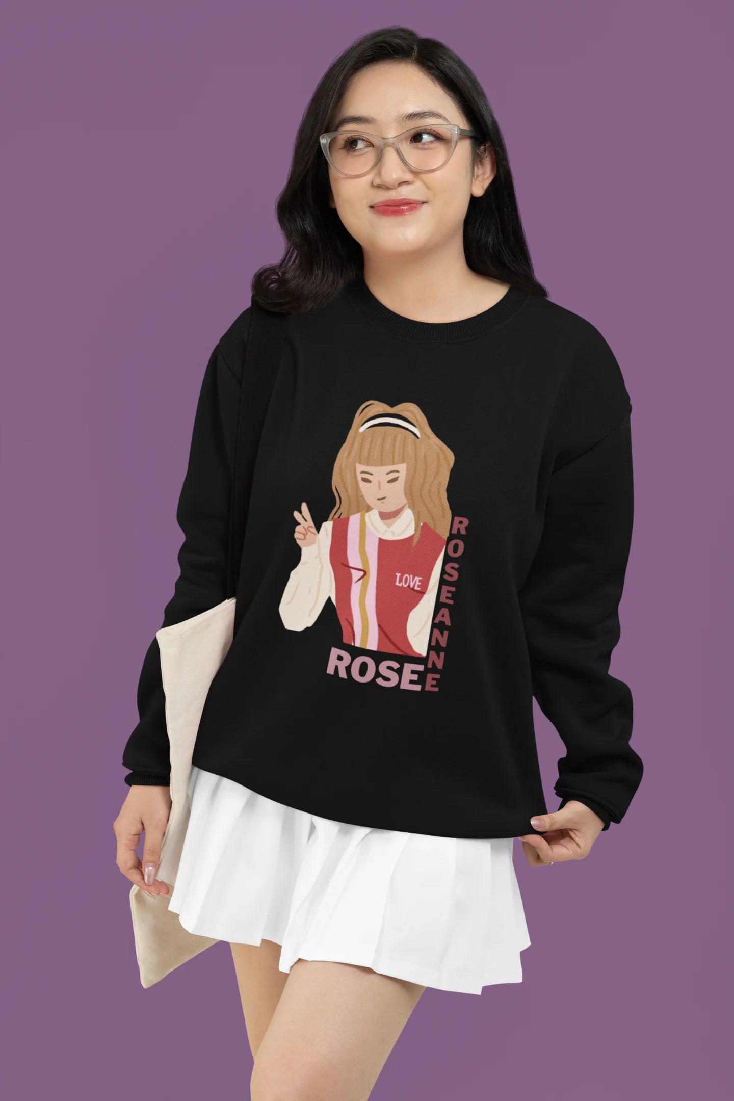 First front view of a female model wearing a black sweatshirt featuring a stylish design inspired by Blackpink member Rosé. Ideal for fans of Rosé, Blackpink, and K-Pop music enthusiasts.