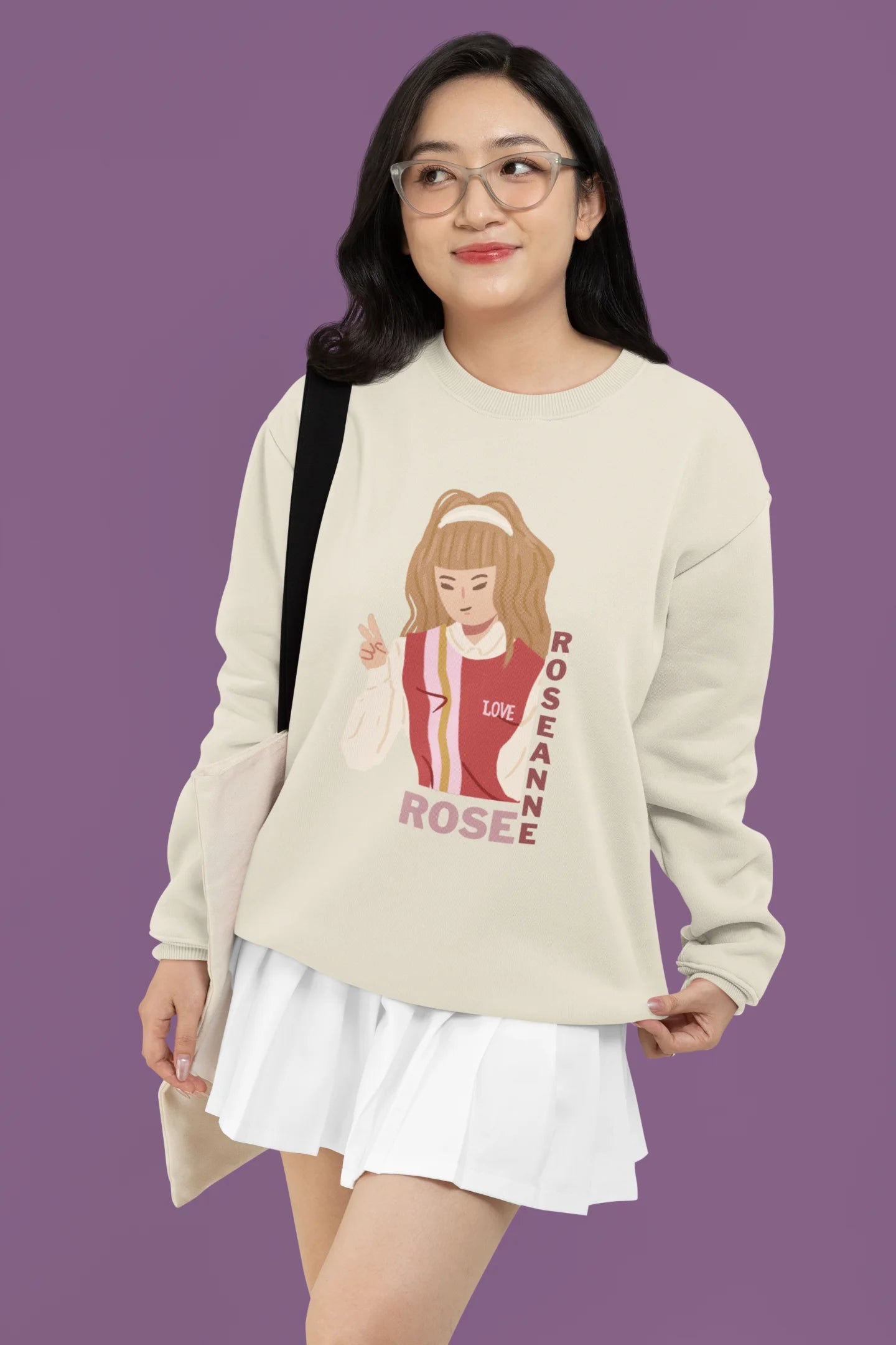 Third front view of a female model wearing a cream sweatshirt featuring a stylish design inspired by Blackpink member Rosé. Ideal for fans of Rosé, Blackpink, and K-Pop music enthusiasts.