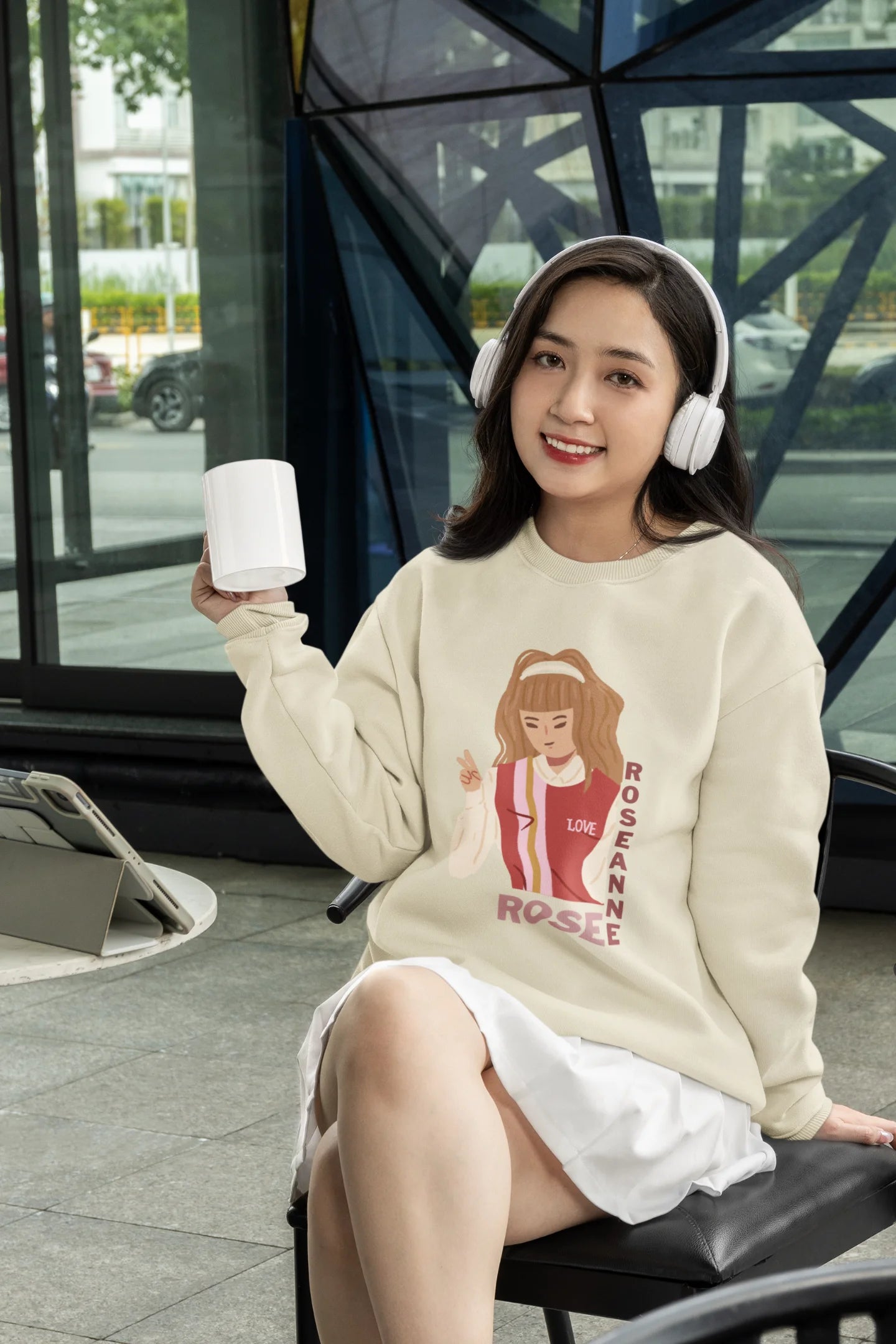 Fourth front view of a female model wearing a cream sweatshirt featuring a stylish design inspired by Blackpink member Rosé. Ideal for fans of Rosé, Blackpink, and K-Pop music enthusiasts.