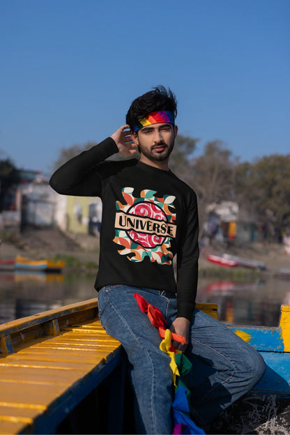 Second front view of a male model wearing an black sweatshirt with a cosmic Universe design inspired by Coldplay.