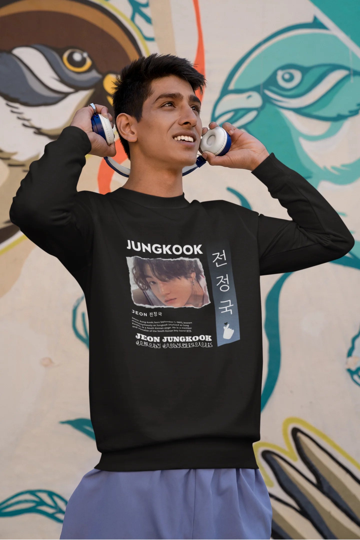 First front view of a male model wearing a black sweatshirt featuring a vibrant design inspired by BTS member Jungkook. Ideal for fans of BTS and K-Pop music in general.