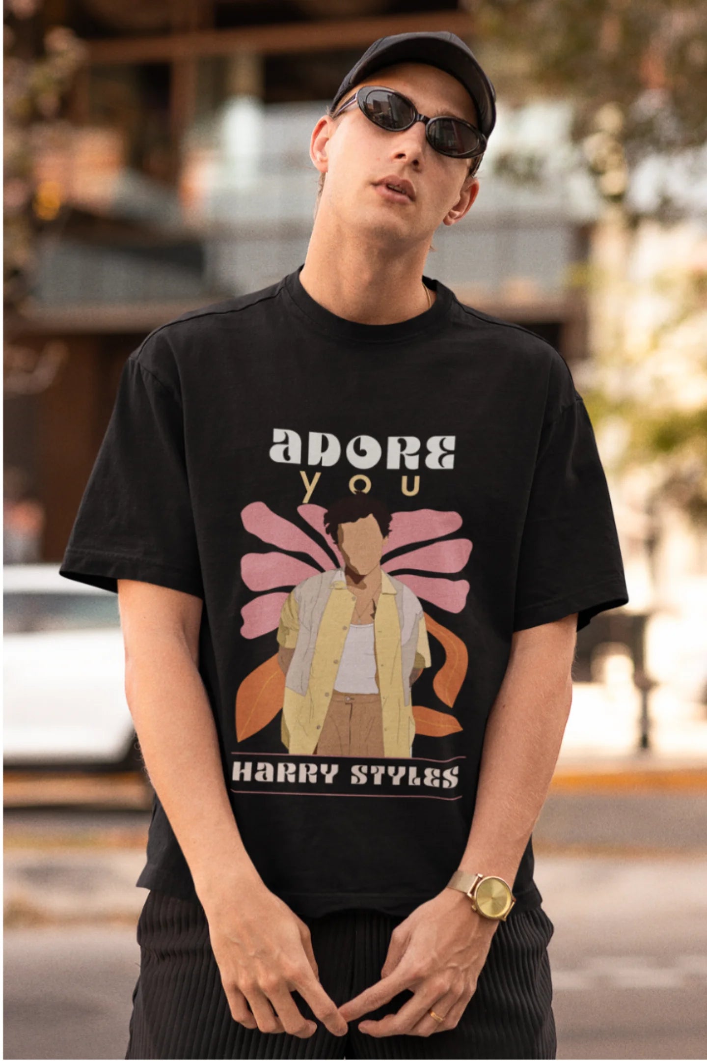 First image of man wearing black oversized t-shirt featuring 'Adore You' inspired design - ideal for fans of Harry Styles and One Direction