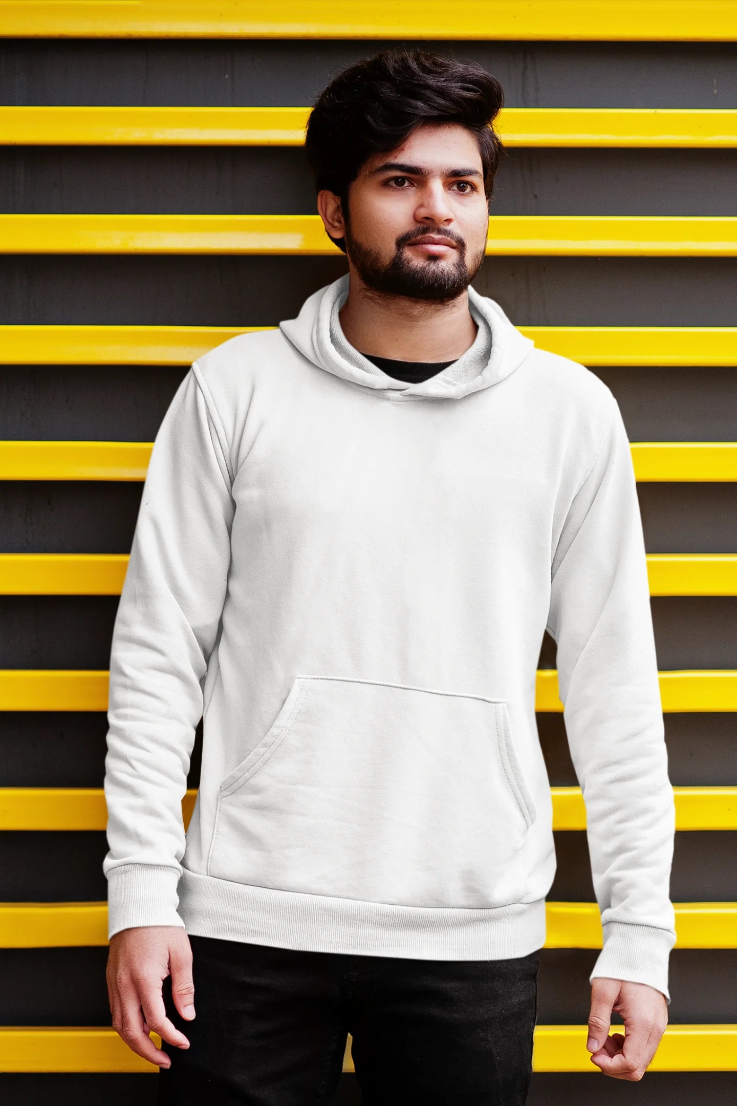 First front view of a male model wearing a white hoodie with a design of a cat dressed as a samurai, standing against a backdrop of waves and a rising sun.