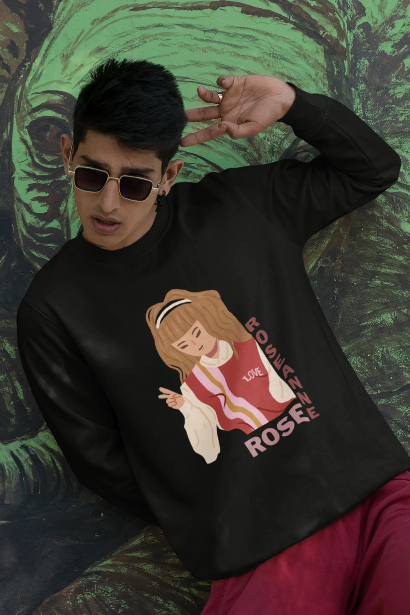 Second view of a male model wearing a black sweatshirt featuring a stylish design inspired by Blackpink member Rosé. Ideal for fans of Rosé, Blackpink, and K-Pop music enthusiasts.