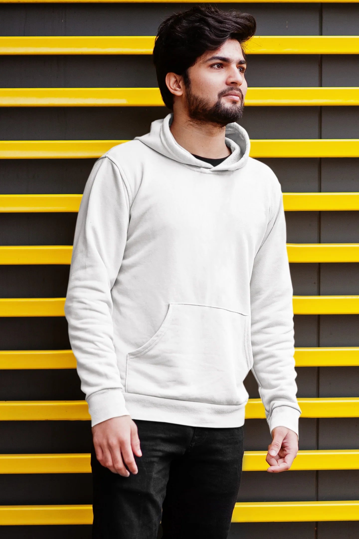 Second front view of a male model wearing a white hoodie with a design of a cat dressed as a samurai, standing against a backdrop of waves and a rising sun.