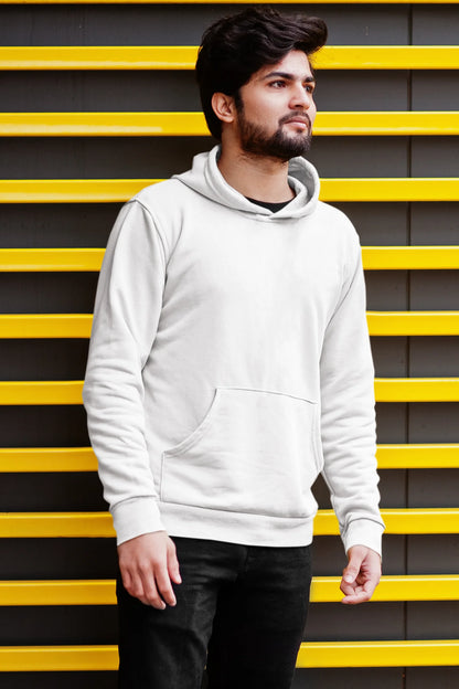 Second front view of a male model wearing a white hoodie with a design of a cat dressed as a samurai, standing against a backdrop of waves and a rising sun.