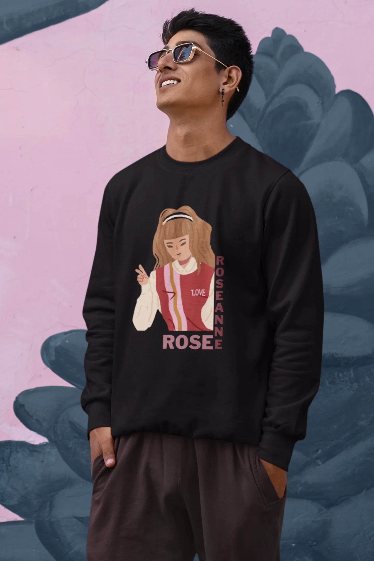 Third view of a male model wearing a black sweatshirt featuring a stylish design inspired by Blackpink member Rosé. Ideal for fans of Rosé, Blackpink, and K-Pop music enthusiasts.