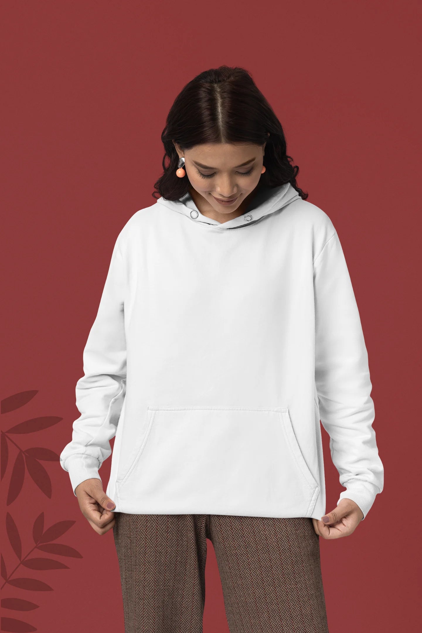 First front view of a female model wearing a white hoodie with a design of a cat dressed as a samurai, standing against a backdrop of waves and a rising sun.