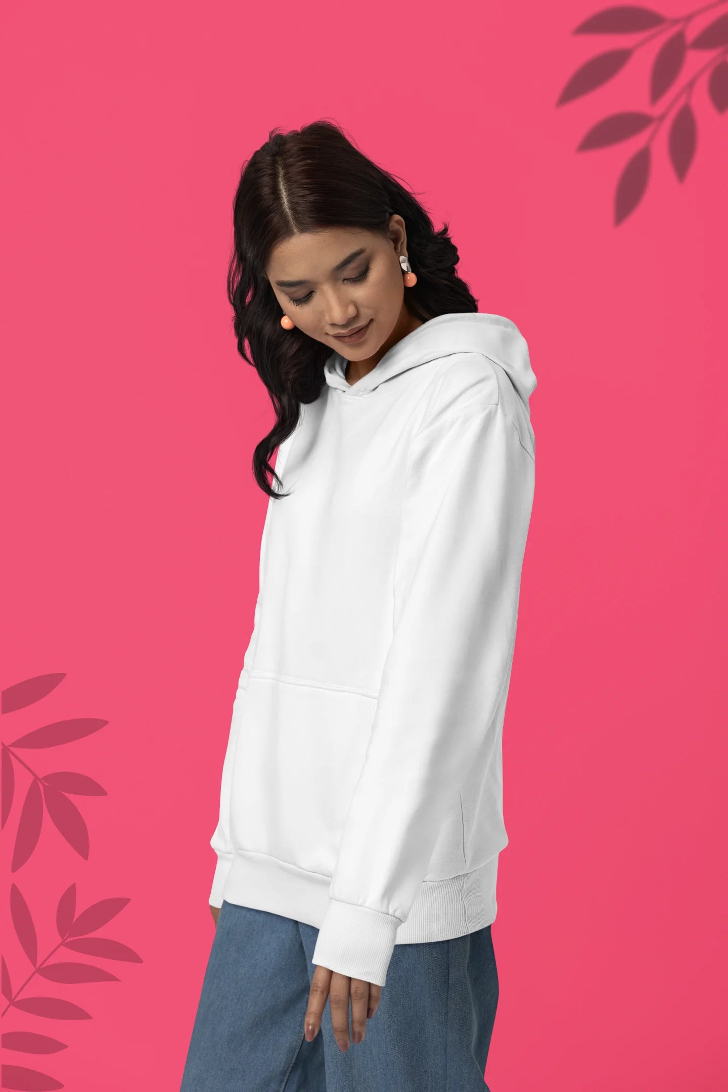 Second front view of a female model wearing a white hoodie with a design of a cat dressed as a samurai, standing against a backdrop of waves and a rising sun.