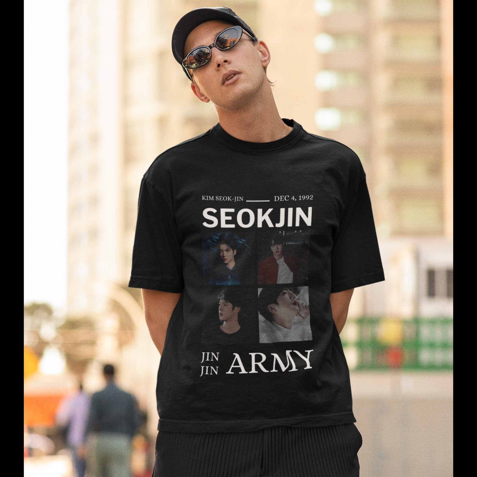 First front view of male model wearing an black oversized t-shirt featuring a bold design inspired by BTS member Jin. Ideal for BTS fans (ARMY) and K-Pop enthusiasts looking for unique Korean Wave fashion.