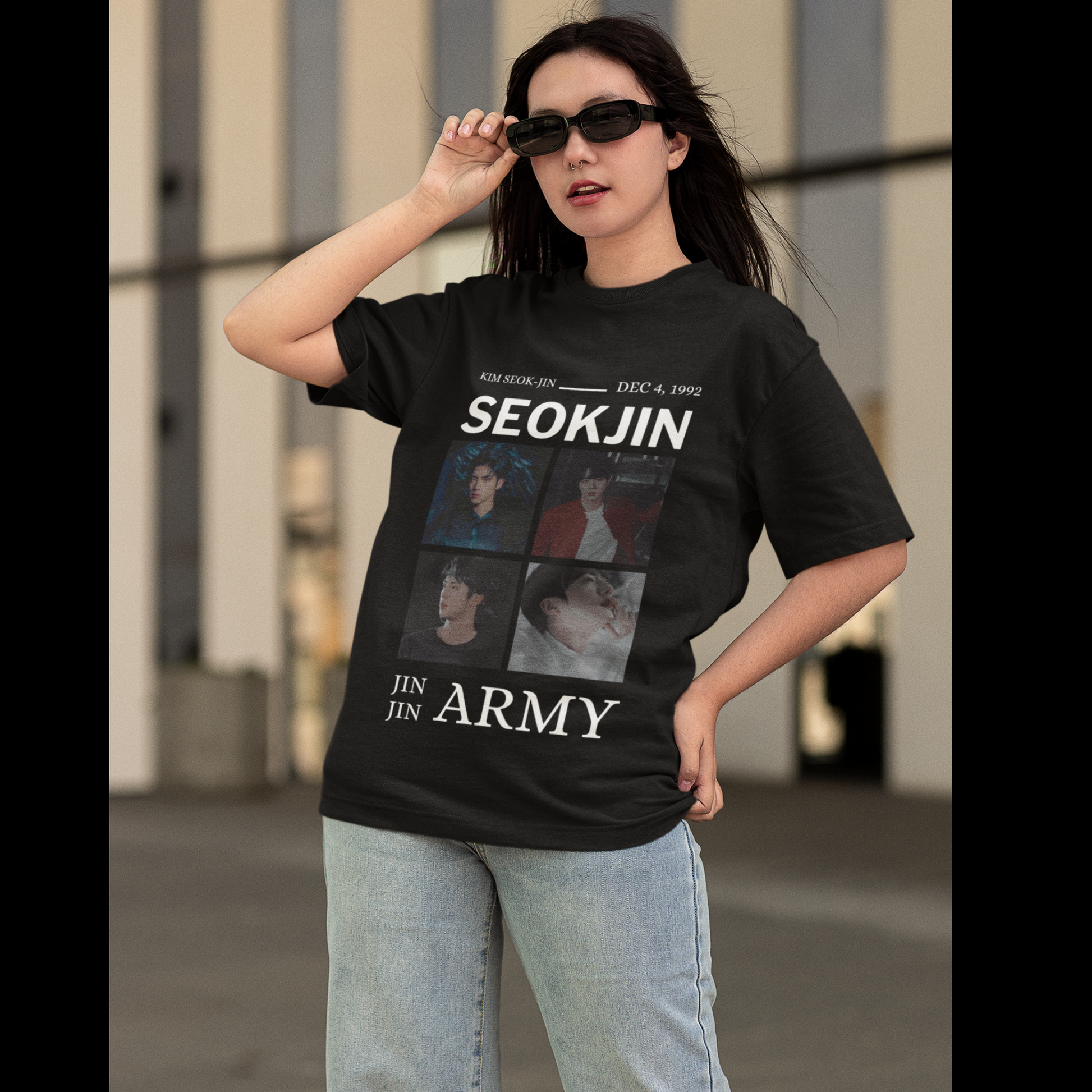 First front view of female model wearing an black oversized t-shirt featuring a bold design inspired by BTS member Jin. Ideal for BTS fans (ARMY) and K-Pop enthusiasts looking for unique Korean Wave fashion.