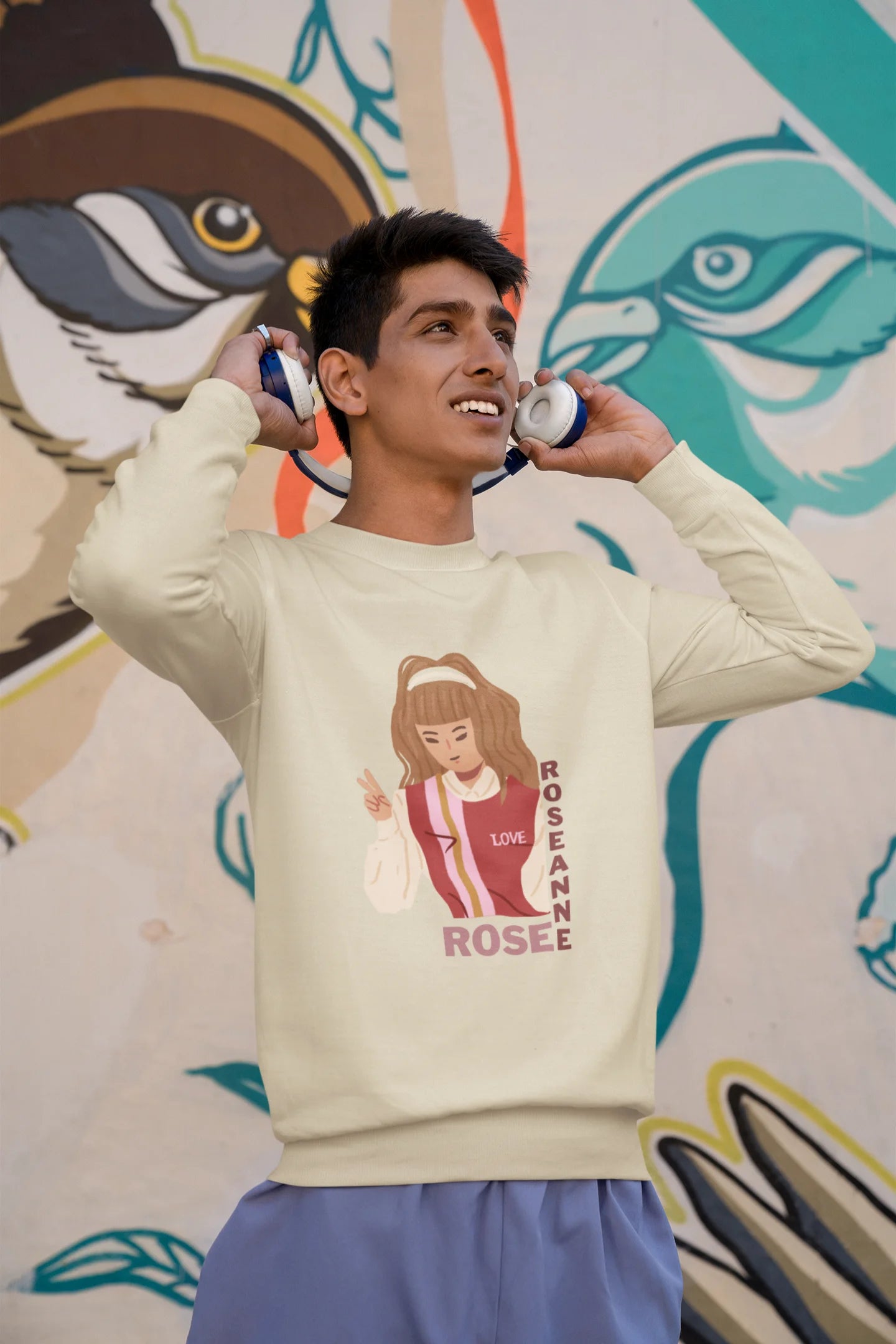 First front view of a male model wearing a cream sweatshirt featuring a stylish design inspired by Blackpink member Rosé. Ideal for fans of Rosé, Blackpink, and K-Pop music enthusiasts.