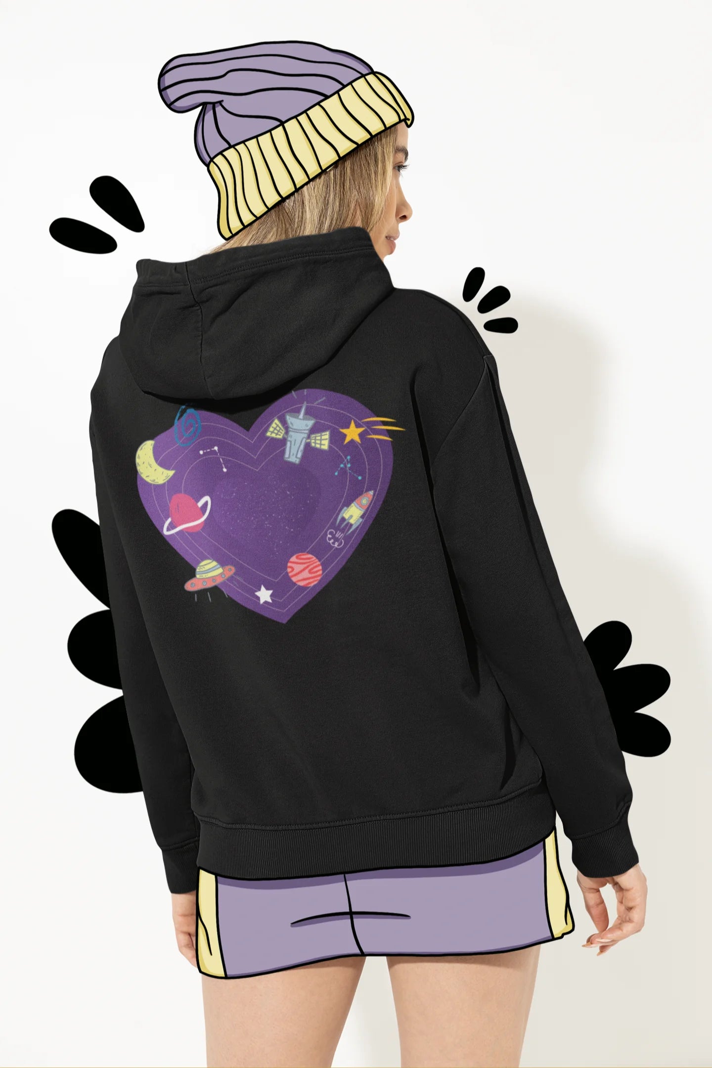 Back view of a female model wearing an black hoodie with the "Paradise" album artwork by Coldplay.